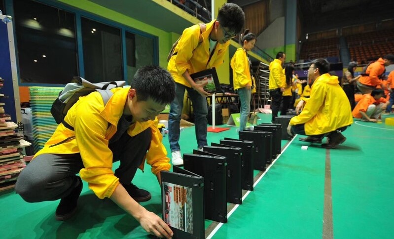 laptops being toppled in domino fashion