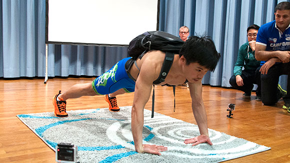 push-ups-using-the-back-of-hands-carrying-40-lb-pack-in-one-minute-header_tcm25-411468-411818