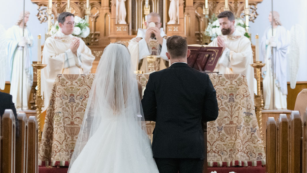 couple getting married at altar