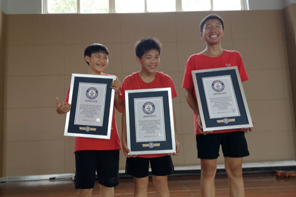 3 school kids holding seperate gwr certificates
