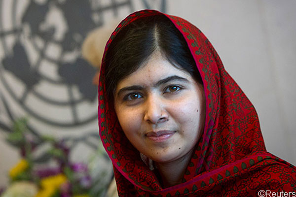 malala wearing headscarf looking into camera